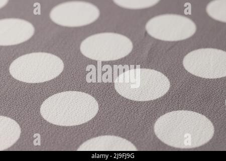 Fabric beige in white circles closeup. Texture background Stock Photo