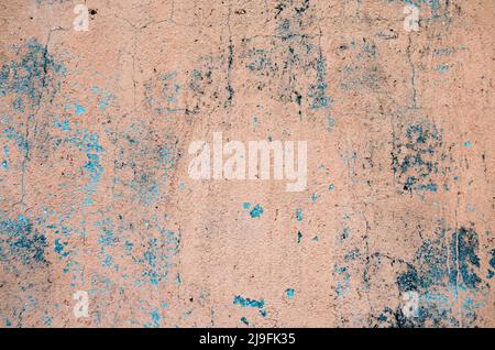 Colorful cement wall background texture. Old orange aged cement wall with stains, scuffs, cracks, scratches. Concrete surface covered with paint crack Stock Photo