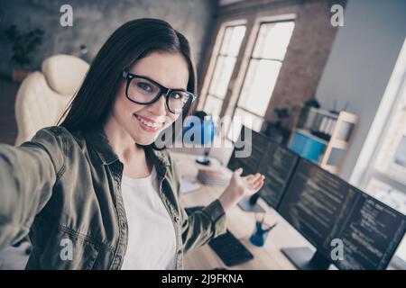 Photo of young pretty girl indicate hand workplace date support tester professional website jawascript indoors Stock Photo