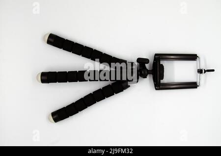 Isolated single mini smartphone tripod on white background Stock Photo