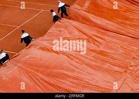 23 May 2022, France, Paris: Tennis: Grand Slam, French Open. A rain tarpaulin is pulled over the Simonne Mathieu court. Photo: Frank Molter/dpa Stock Photo