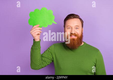 Portrait of good mood positive young male brainstorming generating new ideas isolated on purple color background Stock Photo