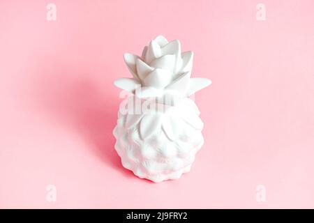 White pineapple tropical fruit on light pastel pink background. Stock Photo