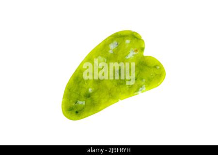Green quartz stone gua sha scraper for facial beauty lifting anti age massage isolated on white background. Stock Photo