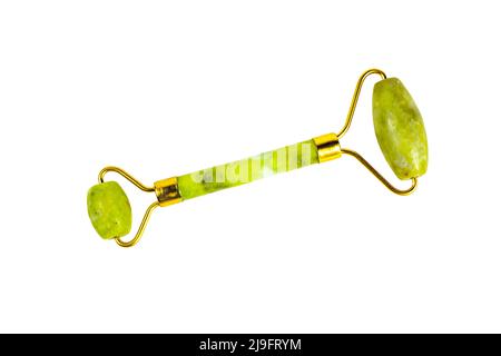 Green quartz stone jade roller for facial beauty lifting anti age massage isolated on white background top view. Stock Photo