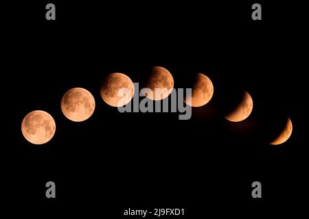 A composite image of the phases of a lunar eclipse over Corsica on 16th May 2022 Stock Photo