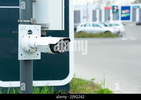 Modern CCTV camera at the entrance to the car park, close up Stock Photo