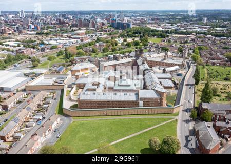 Aerial drone photo of the town of Armley in Leeds West Yorkshire in the UK, showing the famous HM Prison Leeds, or Armley Prison, showing the Jail wal Stock Photo