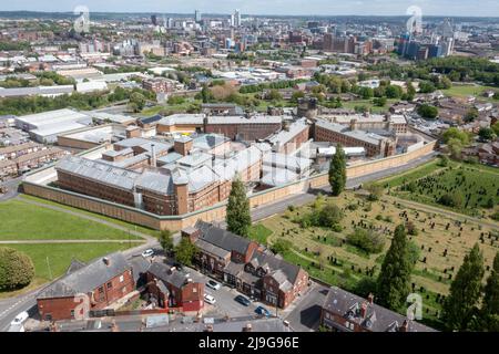 Aerial drone photo of the town of Armley in Leeds West Yorkshire in the UK, showing the famous HM Prison Leeds, or Armley Prison, showing the Jail wal Stock Photo