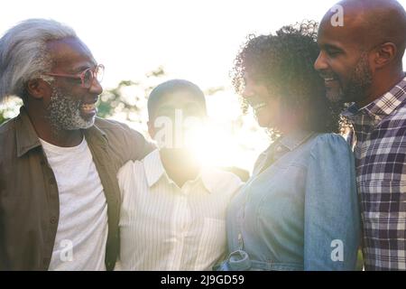 Happy multi-generation family standing in balcony Stock Photo