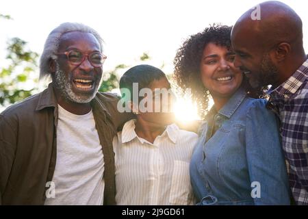 Happy multi-generation family standing in balcony Stock Photo