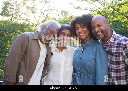 Happy multi-generation family standing in balcony Stock Photo