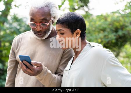 Couple using smart phone Stock Photo