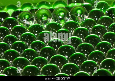 creative balls that reflect the green abstract color, the futuristic look of alien eggs Stock Photo