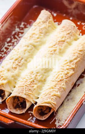 beef burritos in baking plate Stock Photo