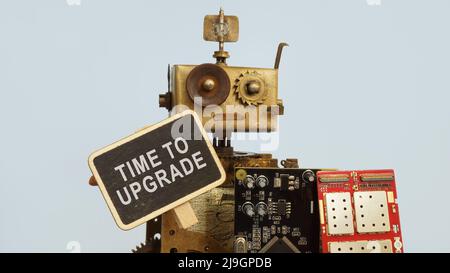 The old robot is holding boards. Time to upgrade. Stock Photo