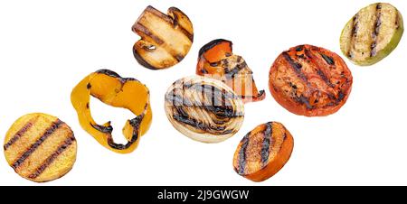 Falling grilled vegetable slices isolated on white background Stock Photo
