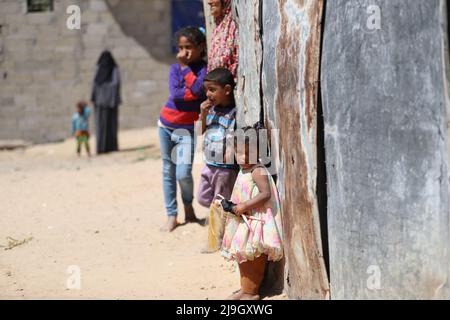 Palestinian children play near their house in a slum in Beit Hanoun in the northern Gaza Strip near the border with Israel. Palestine. Stock Photo