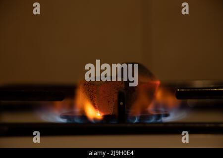 Gas stove in the kitchen with burning coals, burning gas in the kitchen, gas stove Stock Photo