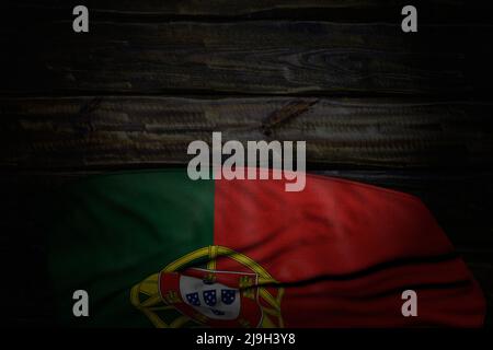 beautiful dark illustration of Portugal flag with large folds on old wood with empty space for text - any occasion flag 3d illustration Stock Photo