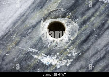 Marble as a background, drill hole Stock Photo