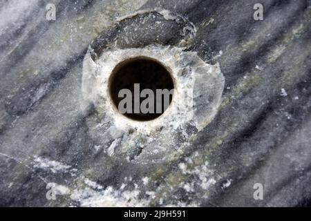 Marble as a background, drill hole Stock Photo