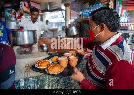 New Delhi, India. 18th Feb, 2022. Local waiter prepares serving tea for people at Sharma tea stall in Hazratganj. Tea is an integral part of everyday life in India. (Credit Image: © Pradeep Gaur/SOPA Images via ZUMA Press Wire) Stock Photo