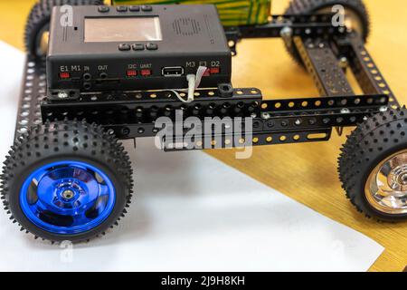 programmable children's robot car in the form of a platform on wheels Stock Photo