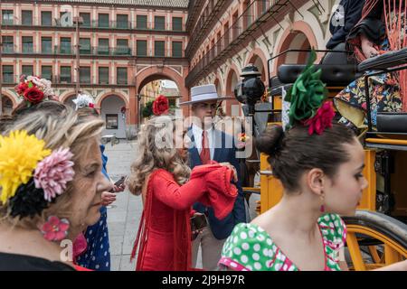 A group of women dressed as flamencos board a horse cart in the Plaza de la Corredera, during the celebration. After two years suspended due to the global pandemic caused by Covid-19, the city of Córdoba, once again celebrated the Our Lady of Health Fair, better known as the Córdoba Fair. This celebration is one of the most important in the region of Andalusia and has been held for more than 500 years. During these days thousands of men and women parade through the streets of El Arenal, the fairgrounds to dance and celebrate one of the most traditional festivals in Spain. (Photo by Israel Fugu Stock Photo