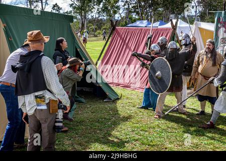 Photographers photographing warriors in chain mail during medievil historical living history display. Glen Innes Celtic Festival, NSW Australia Stock Photo