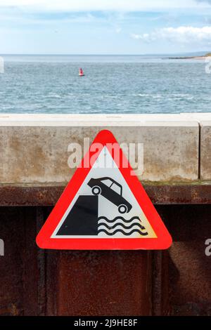 car and deep water warning sign in Exmouth Devon UK Stock Photo