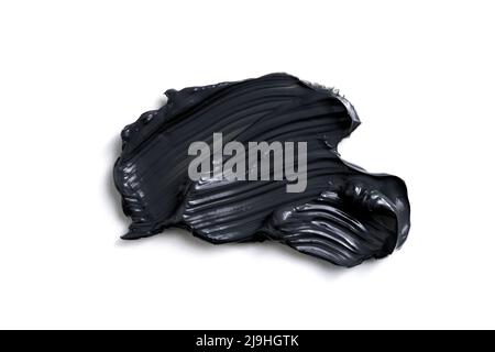 Charcoal face mask stroke isolated on white bacground. Stock Photo