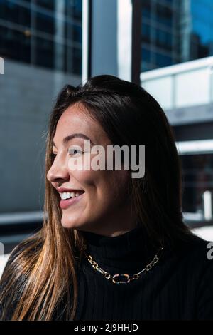Happy young woman with long brown hair Stock Photo