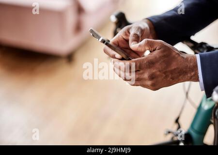 Businessman using smart phone at home Stock Photo