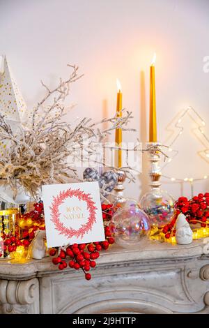 Christmas greeting card and decoration on marble fireplace Stock Photo