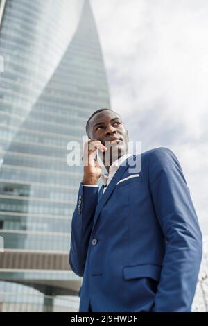Young businessman talking on mobile phone Stock Photo
