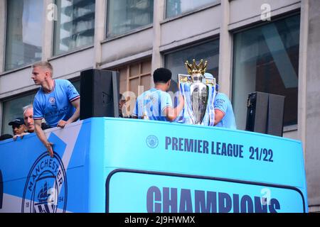 Manchester, UK, 23rd May, 2022.  Oleksandr Zinchenko on the left reacts to the crowds. Manchester City Football Club holds a victory parade to celebrate the club's Premier League title win after beating Aston Villa at the Etihad Stadium on 22nd May. The parade of open top buses went through central Manchester, England, United Kingdom, watched by large, enthusiastic crowds. Credit: Terry Waller/Alamy Live News Stock Photo