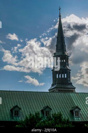 The spire of the Christ Church Anglican cathedral a neo-gothic architecture at Ville-Marie, Montreal, Quebec, Canada Stock Photo