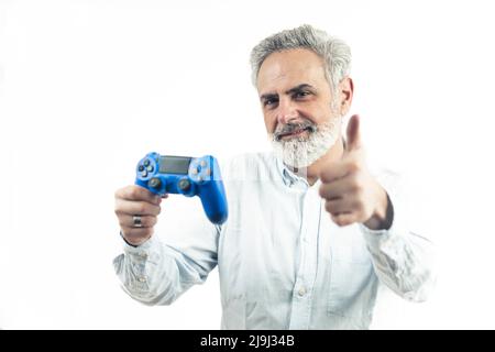 middle aged man holding the gamepad controller - isolated on white background. High quality photo Stock Photo