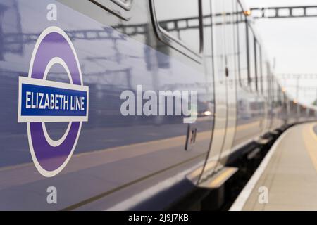 London, UK 23rd May 2022: side view of purple Train carriage leaving platform: After The Crossrail project have successfully completed the final stage of testing the line this week, much-delayed Elizabeth line is to open to paying customers between Paddington and Abbey Wood  on Tuesday 24th May 2022 , the week prior to the Queen’s jubilee celebrations. Credit: glosszoom/Alamy Live News Stock Photo