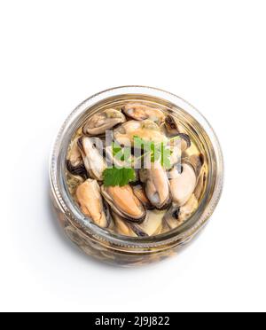 Marinated  mussels in glass jar isolated on white Stock Photo