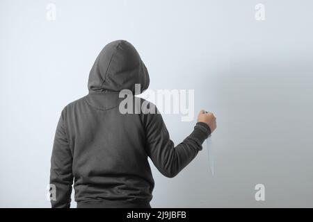 rear view of man holding knife Stock Photo