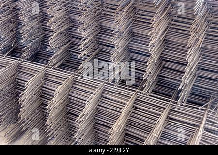 frame mesh of thin corrugated rod stacked vertically, selective focus and toning Stock Photo