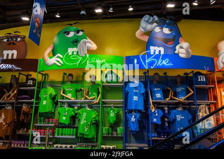 Colored apparel and souvenirs in MMs store in Manhattan. Stock Photo