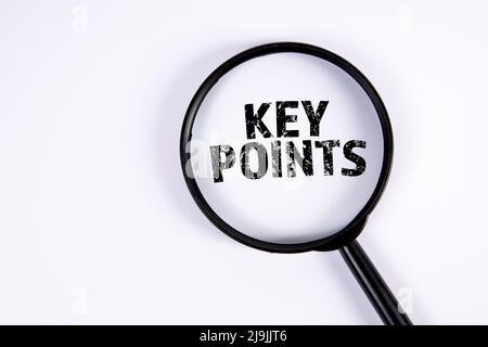 KEY POINTS. Text and magnifying glass on a white background. Stock Photo
