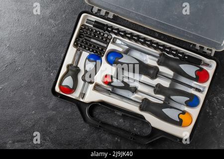 Set of screwdrivers inside toolbox, close up, top view. Set mechanical tools in box Stock Photo