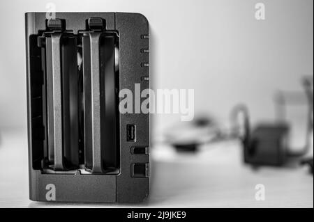 network attached storage NAS with a single bay pulled setup at a home office and remote work redundancy Stock Photo