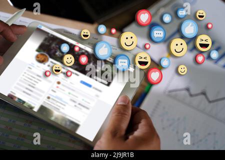 man using smart phone,Social Distancing Social media and Marketing virtual icons screen man watching a live streaming and Working From Home concept Stock Photo