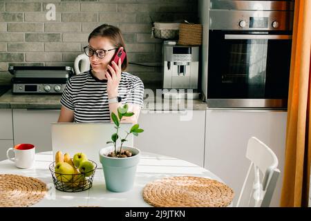 Freelancer smiling woman using smart phone. Lifestyle, social media, small business concept Stock Photo