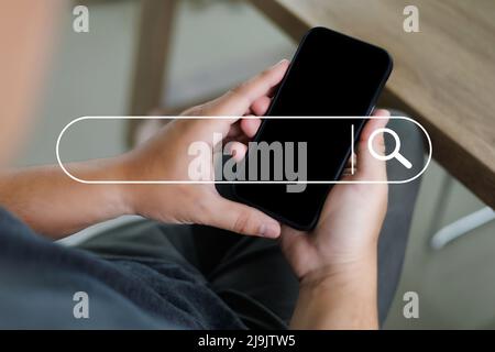 man searching Browsing Internet Data Search Engine Optimization Searching for information Stock Photo